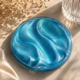 A set of four resin coasters